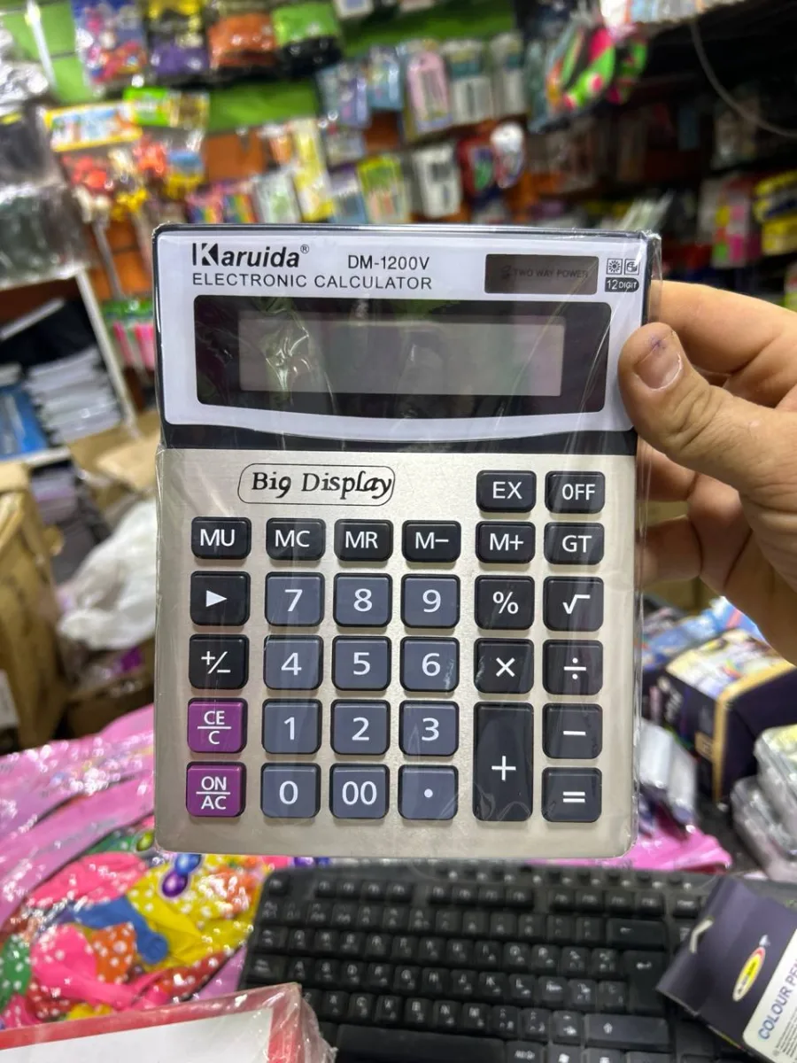صورة الة حاسبة DM 1200